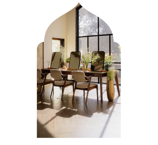 A getting-ready room set up with mirrors and flowers