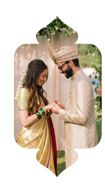 A bride and groom exchanging a ring outdoors
